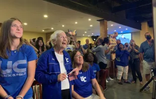 Sister Percylee Hart RSM, principal of Union Catholic Regional High School in New Jersey, sits in front a crowd of students, staff, and alumni as the crowd cheers on Sydney McLaughlin in her Gold medal race at the Tokyo Olympics. Jim Lambert